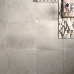 Грандиозен гранитогрес за баня в сив цвят с ефект кожа WORN STONE от Ariana Ceramica (Италия)